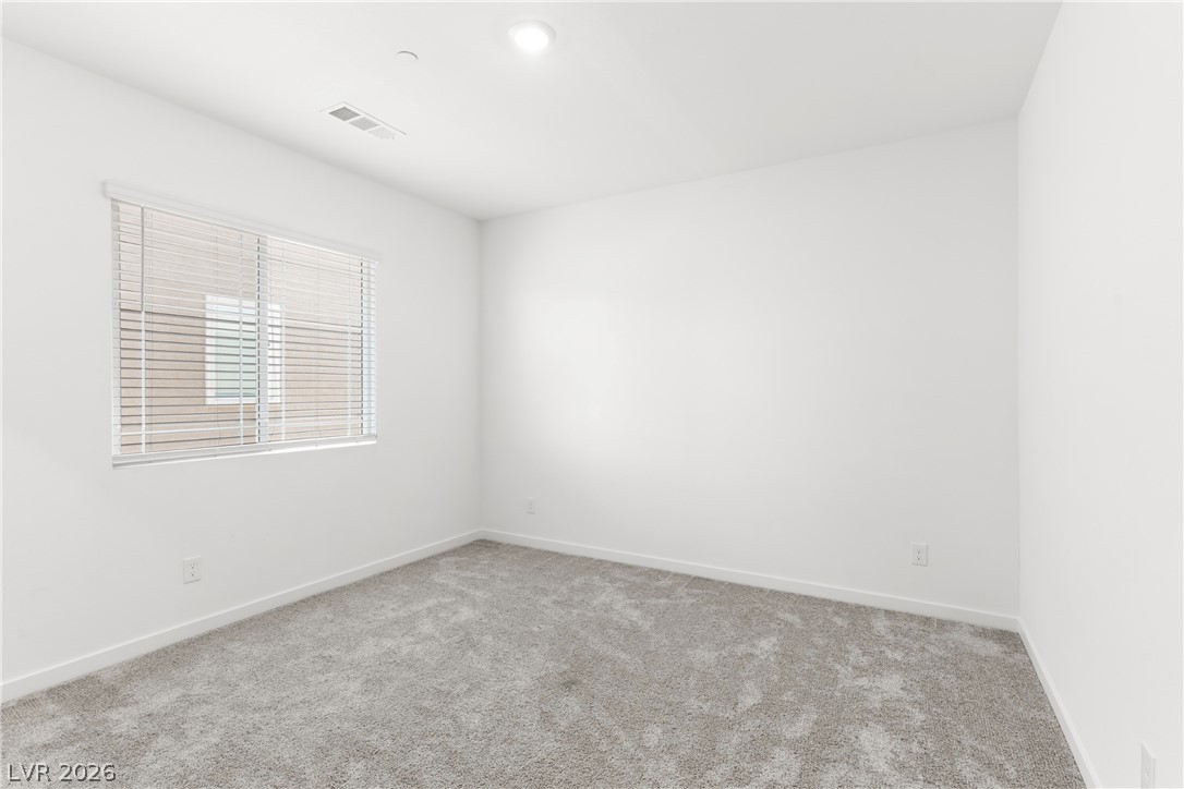 320 Isla Enclave Way Henderson, NV 89011 - Photo 30 of 49 This naturally illuminated bedroom offers a tranquil setting with soft carpeting and simple window treatments.