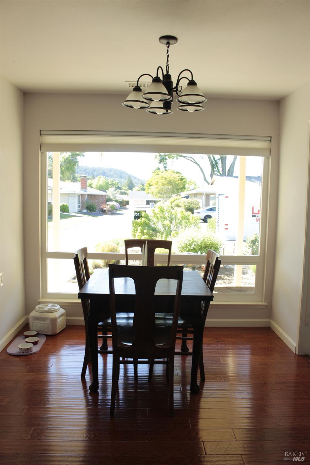 11 Oakgreen Santa Rosa, CA 95409 - Photo 14 of 37 a view of a dining room with furniture window and wooden floor