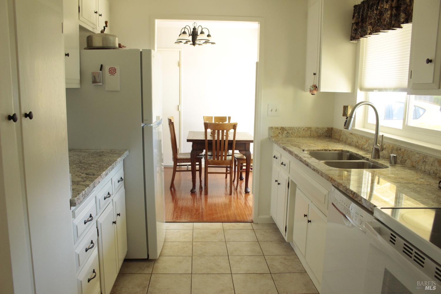 11 Oakgreen Santa Rosa, CA 95409 - Photo 15 of 37 a kitchen with granite countertop a sink appliances and cabinets
