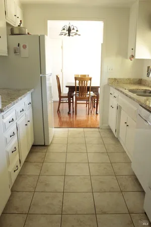 a view of kitchen with furniture and window