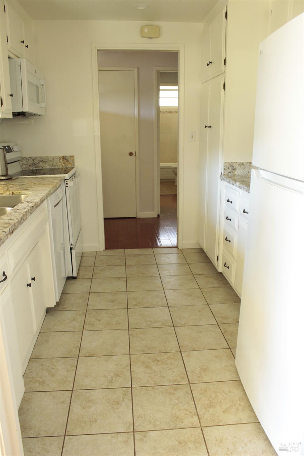 11 Oakgreen Santa Rosa, CA 95409 - Photo 17 of 37 a bathroom with a sink a mirror and a shower