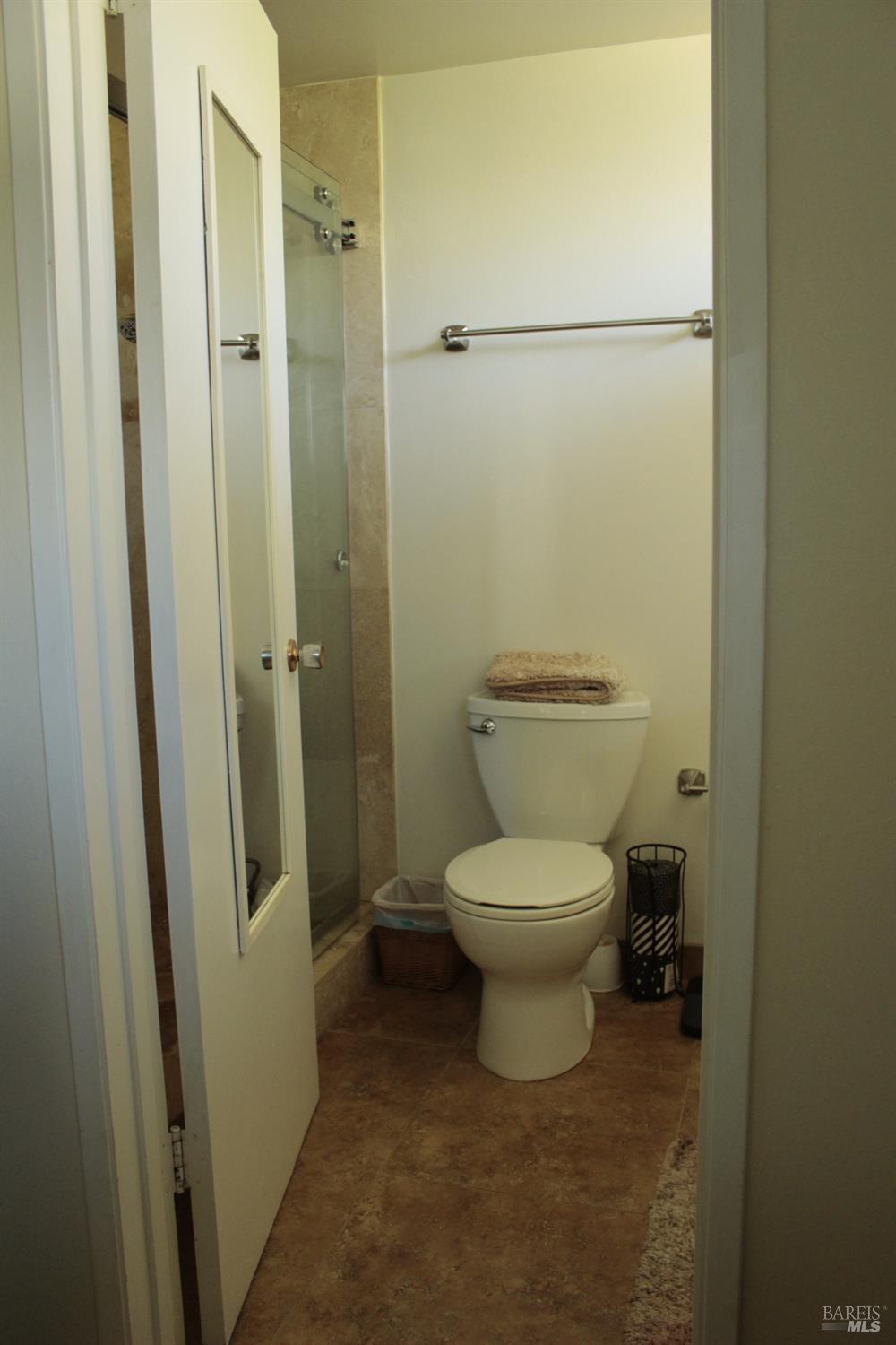 11 Oakgreen Santa Rosa, CA 95409 - Photo 24 of 37 a bathroom with a toilet and a shower