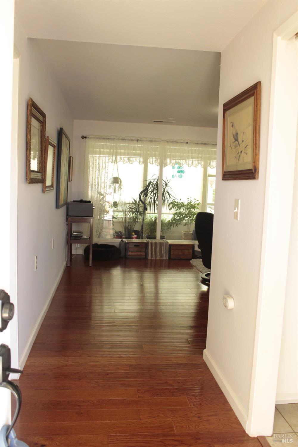11 Oakgreen Santa Rosa, CA 95409 - Photo 10 of 37 a view of a living room and dining room with furniture wooden floor
