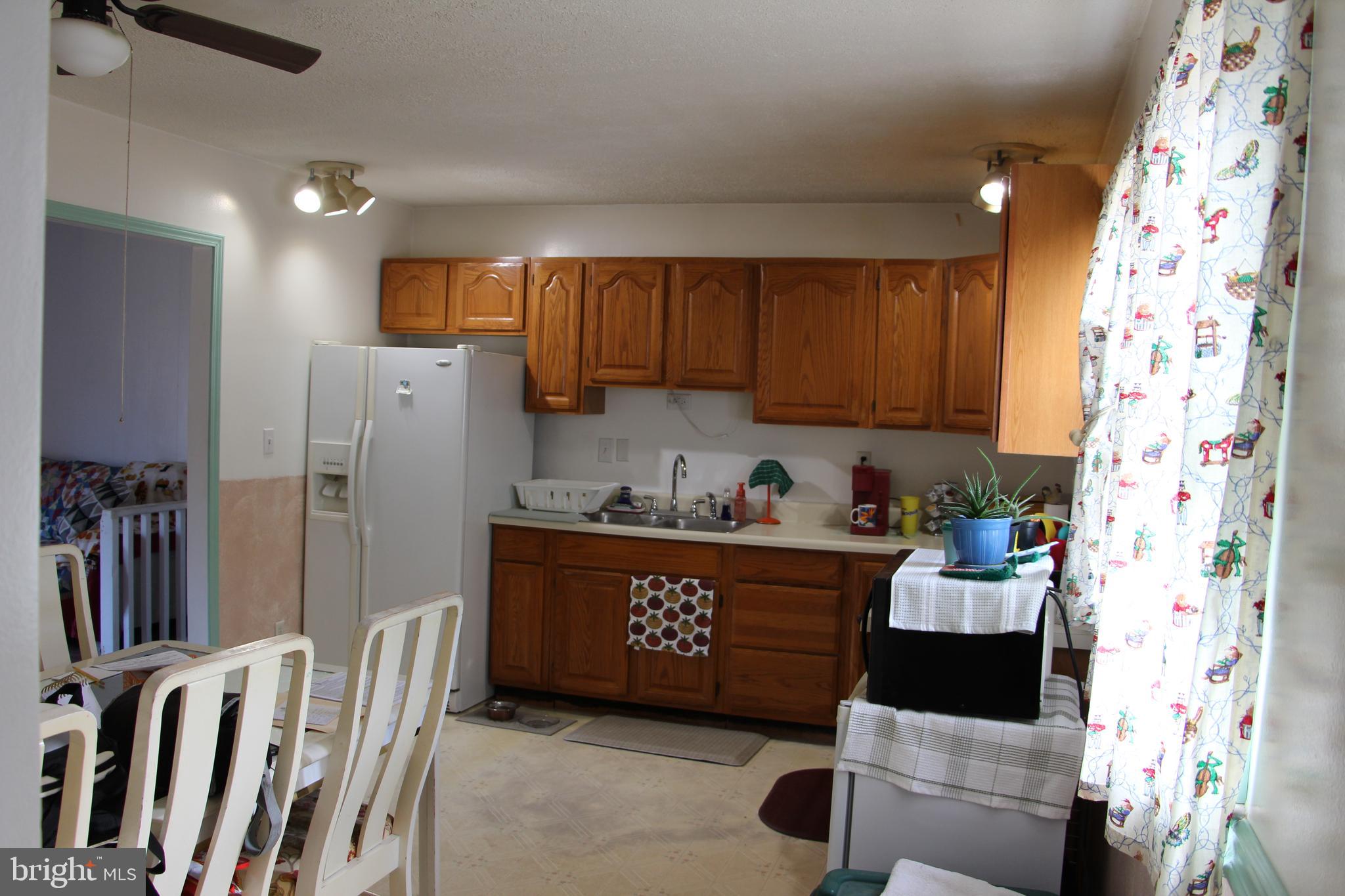 775 Corners Road Cabins, WV 26855 - Photo 11 of 20 a kitchen with stainless steel appliances granite countertop a refrigerator and a stove top oven