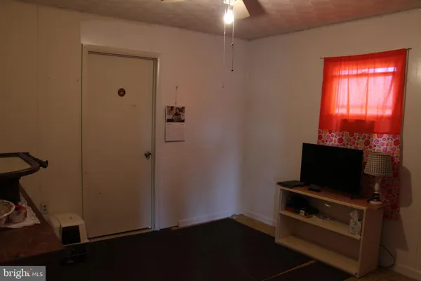 a room with furniture and flat screen tv