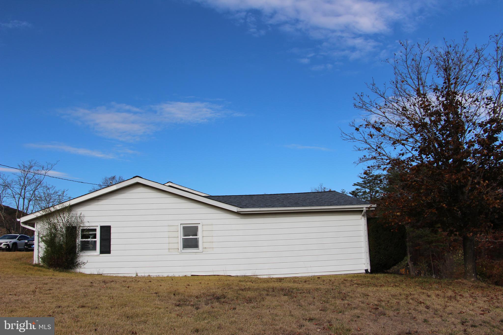 775 Corners Road Cabins, WV 26855 - Photo 3 of 20 a view of a house with a backyard