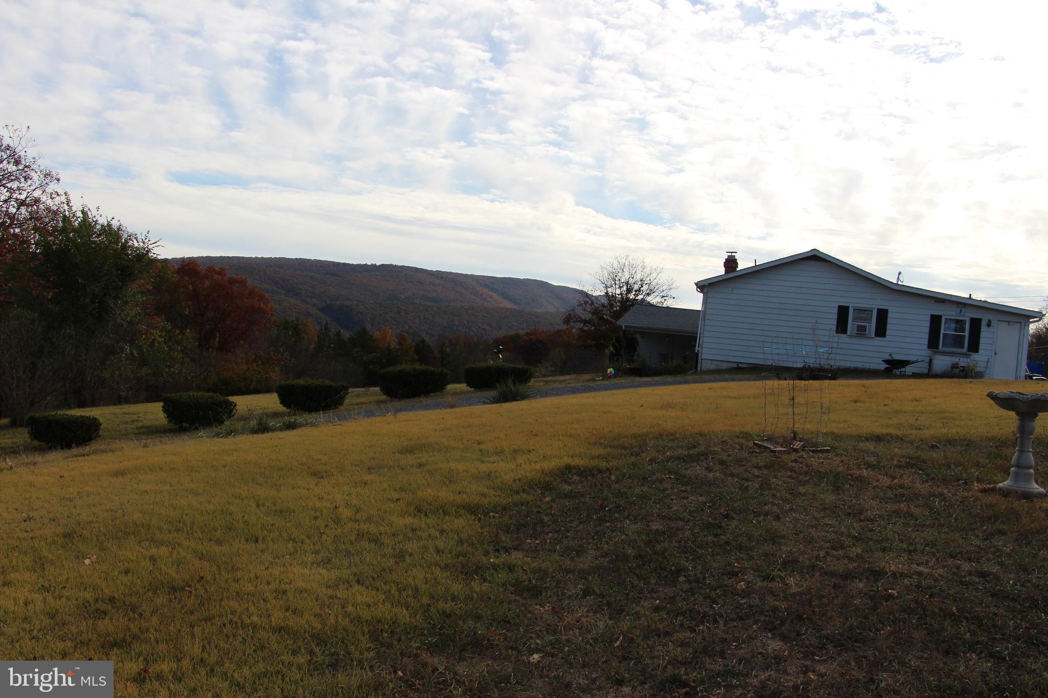 775 Corners Road Cabins, WV 26855 - Photo 4 of 20 a view of a house with a yard