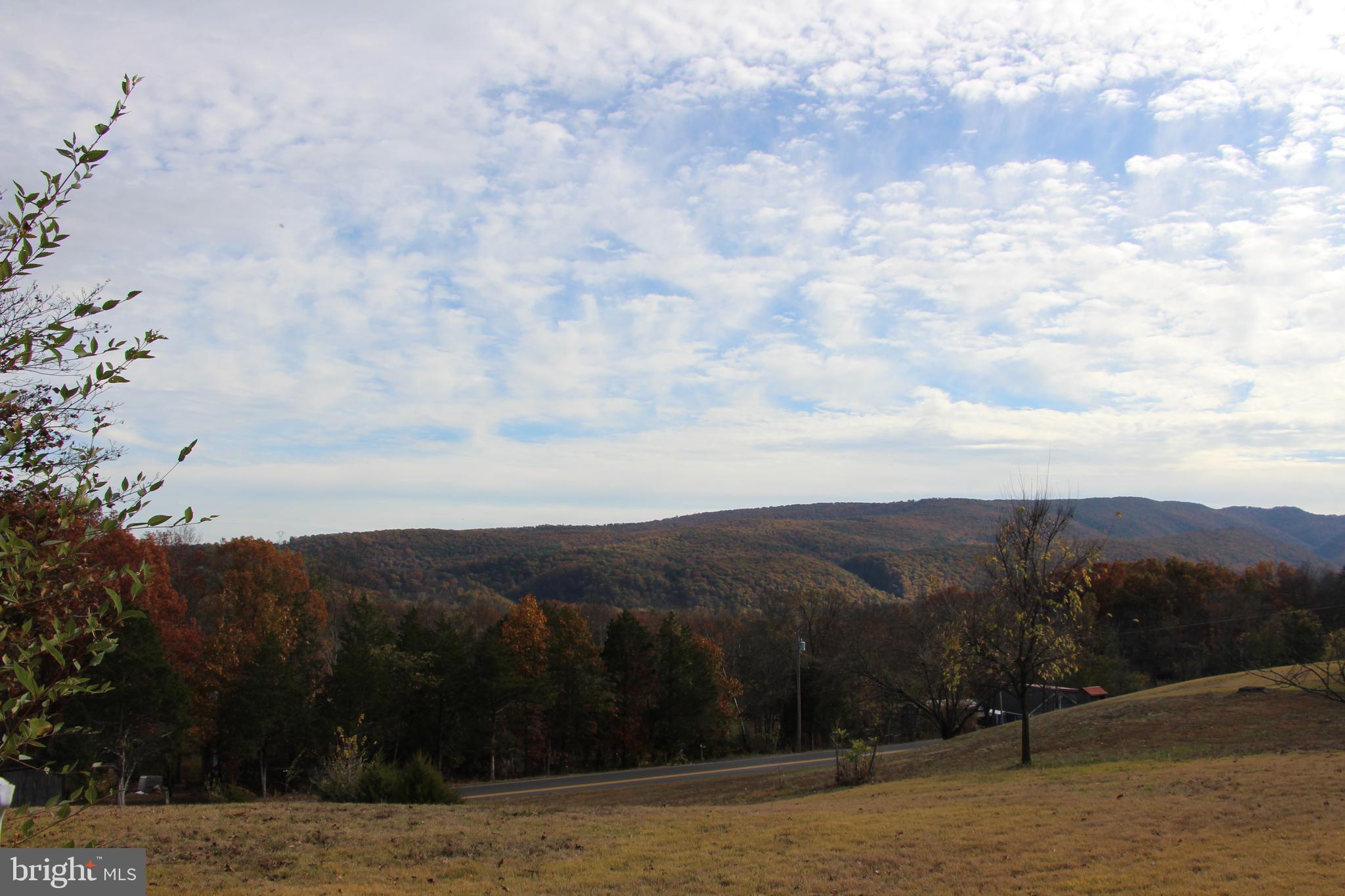 775 Corners Road Cabins, WV 26855 - Photo 6 of 20 a view of a lake with mountains in the background