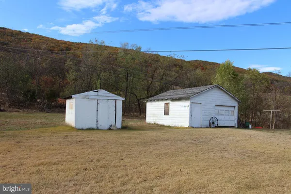 a house with a field in front of it