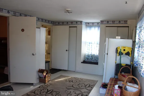 a view of a hallway with elevator and glass door
