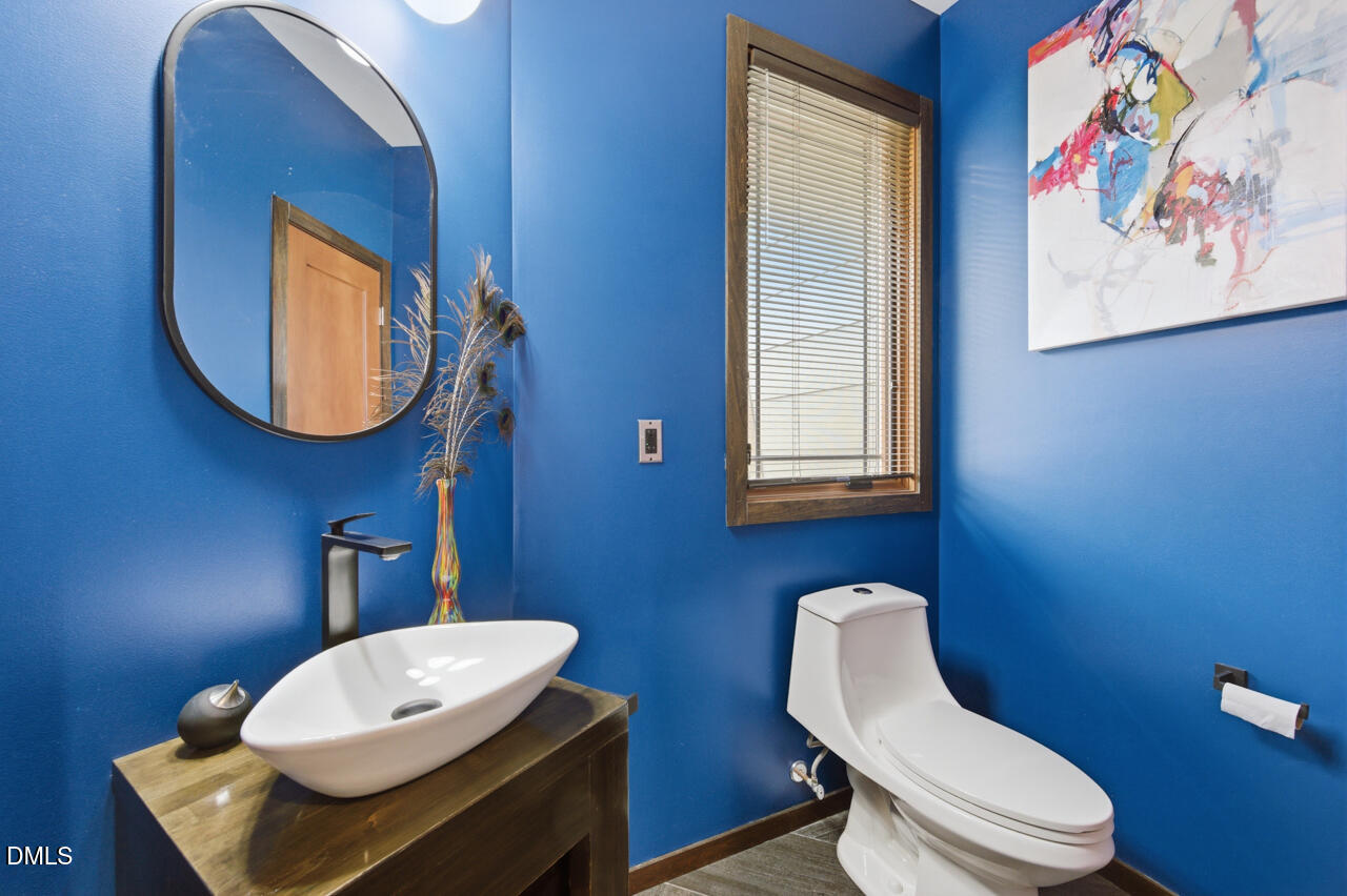 3315 Denada Path Durham, NC 27707 - Photo 25 of 74 a bathroom with a toilet a sink and mirror