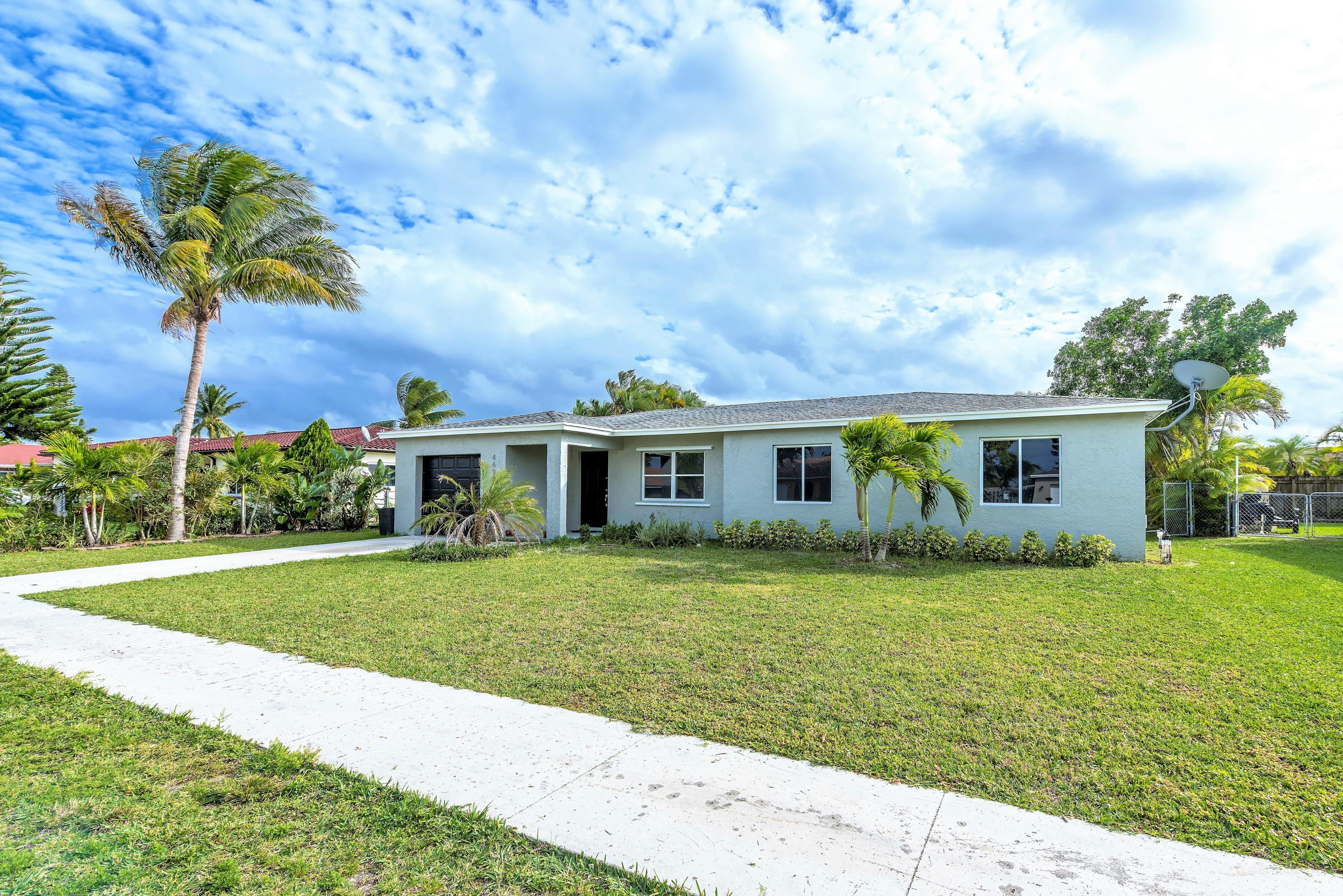 4690 Baldric Street Boca Raton, FL 33428 - Photo 25 of 25 front of house/sidewalk