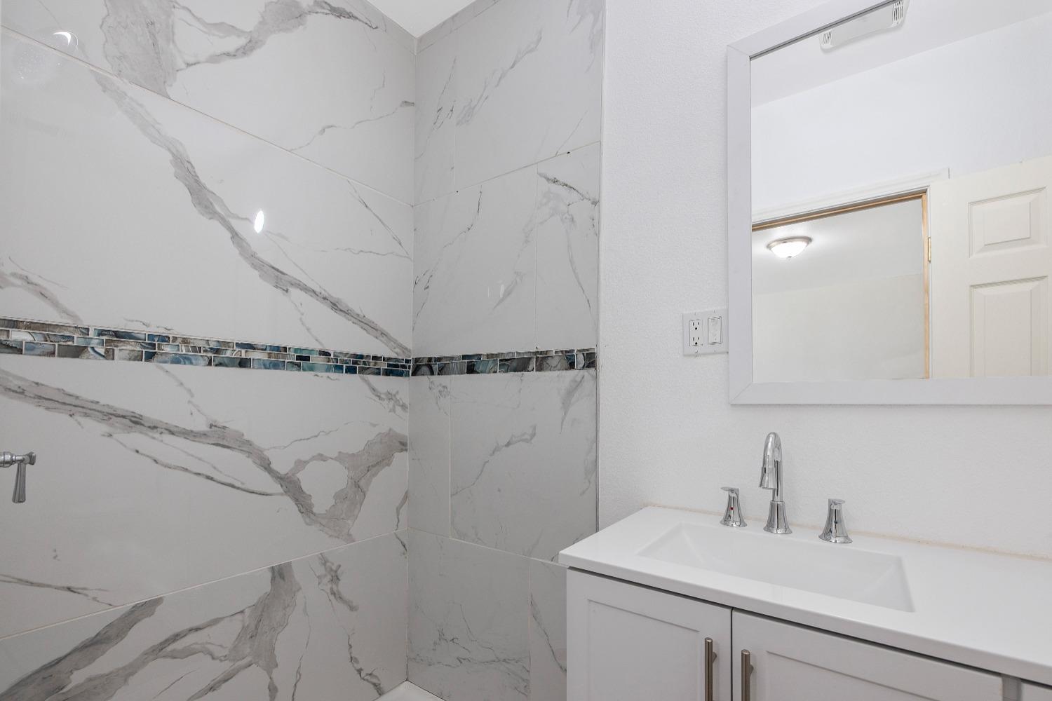 23375 Ave 196 Strathmore, CA 93267 - Photo 19 of 31 a bathroom with a sink and a mirror