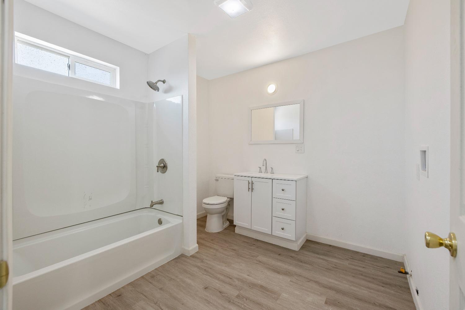 23375 Ave 196 Strathmore, CA 93267 - Photo 21 of 31 a spacious bathroom with a bathtub sink and toilet