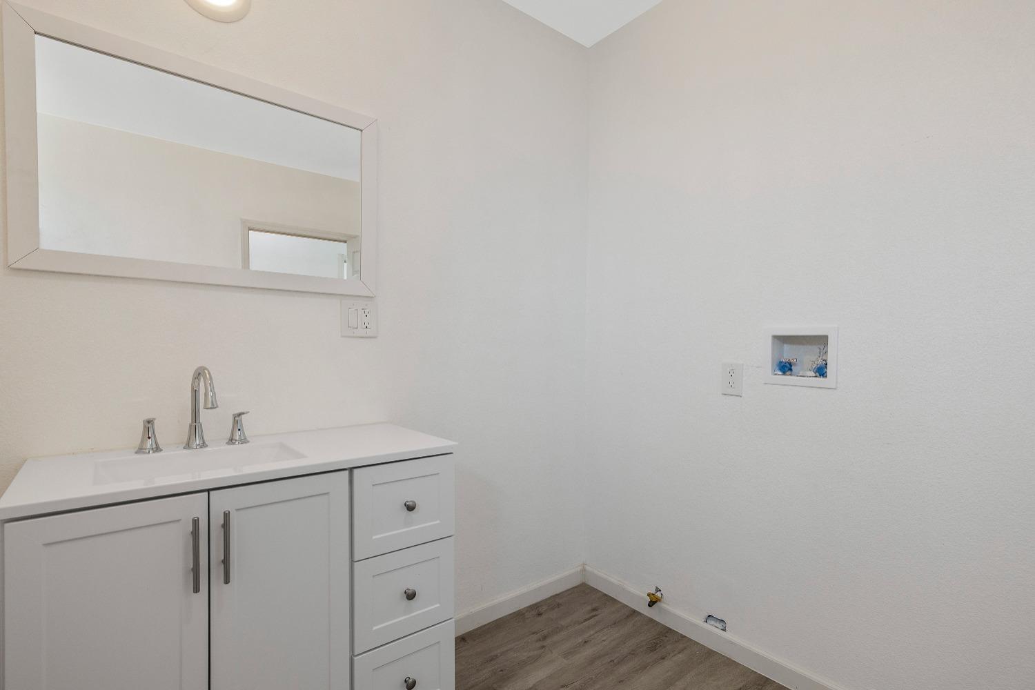 23375 Ave 196 Strathmore, CA 93267 - Photo 22 of 31 a bathroom with a sink and vanity