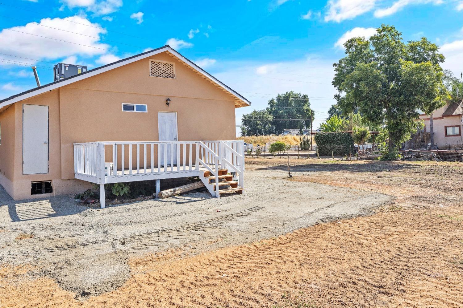 23375 Ave 196 Strathmore, CA 93267 - Photo 23 of 31 a view of a house with a wooden fence