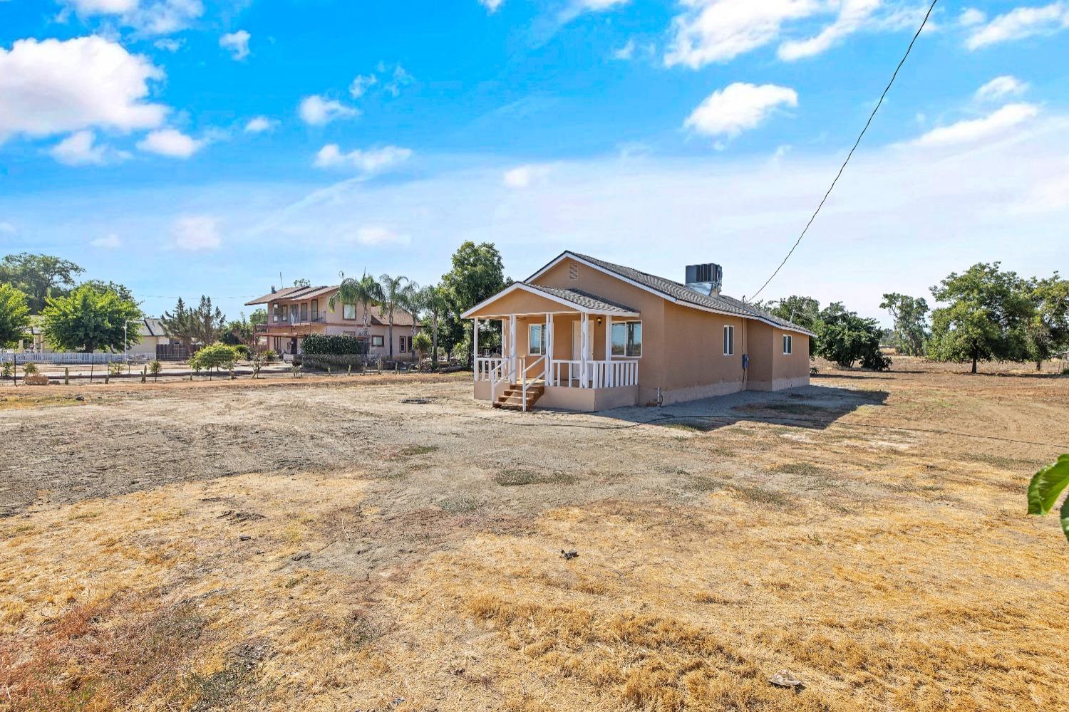 23375 Ave 196 Strathmore, CA 93267 - Photo 4 of 31 a house view with a wooden fence