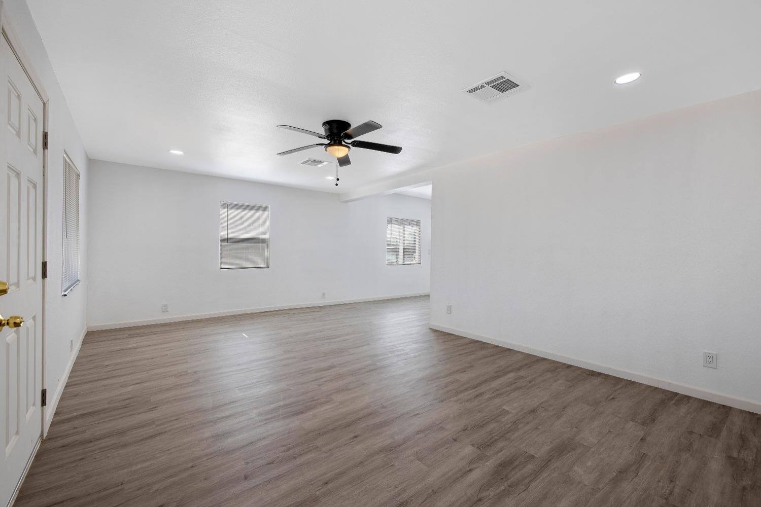 23375 Ave 196 Strathmore, CA 93267 - Photo 6 of 31 an empty room with wooden floor and windows