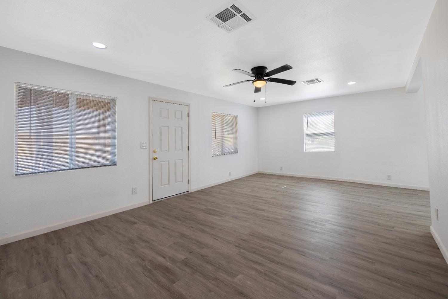 23375 Ave 196 Strathmore, CA 93267 - Photo 7 of 31 a view of an empty room with a window and wooden floor