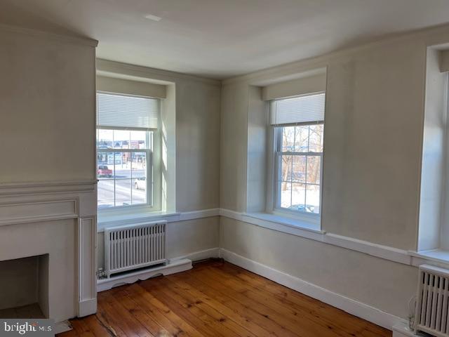 3200 Main Street, Unit 1 Morgantown, PA 19543 - Photo 5 of 9 a view of an empty room with wooden floor and a window