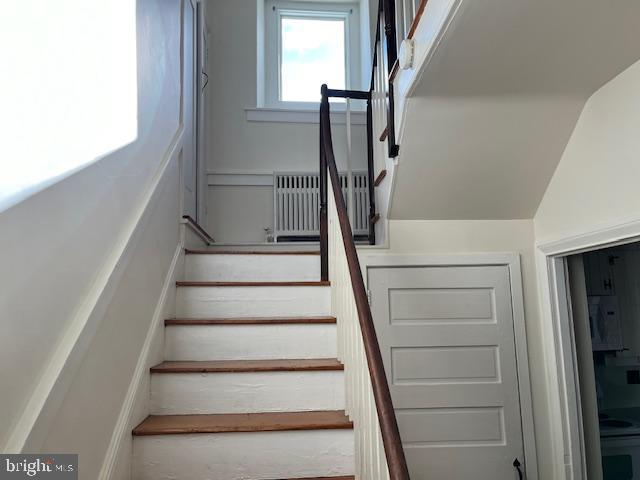 3200 Main Street, Unit 1 Morgantown, PA 19543 - Photo 7 of 9 a view of staircase with white walls and a window