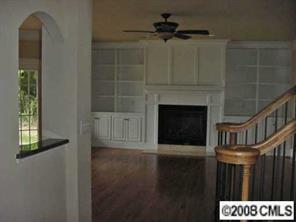 3206 Williams Road Matthews, NC 28105 - Photo 2 of 7 a living room with furniture and a fireplace