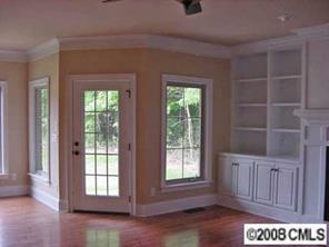 3206 Williams Road Matthews, NC 28105 - Photo 7 of 7 an empty room with a window and wooden floor