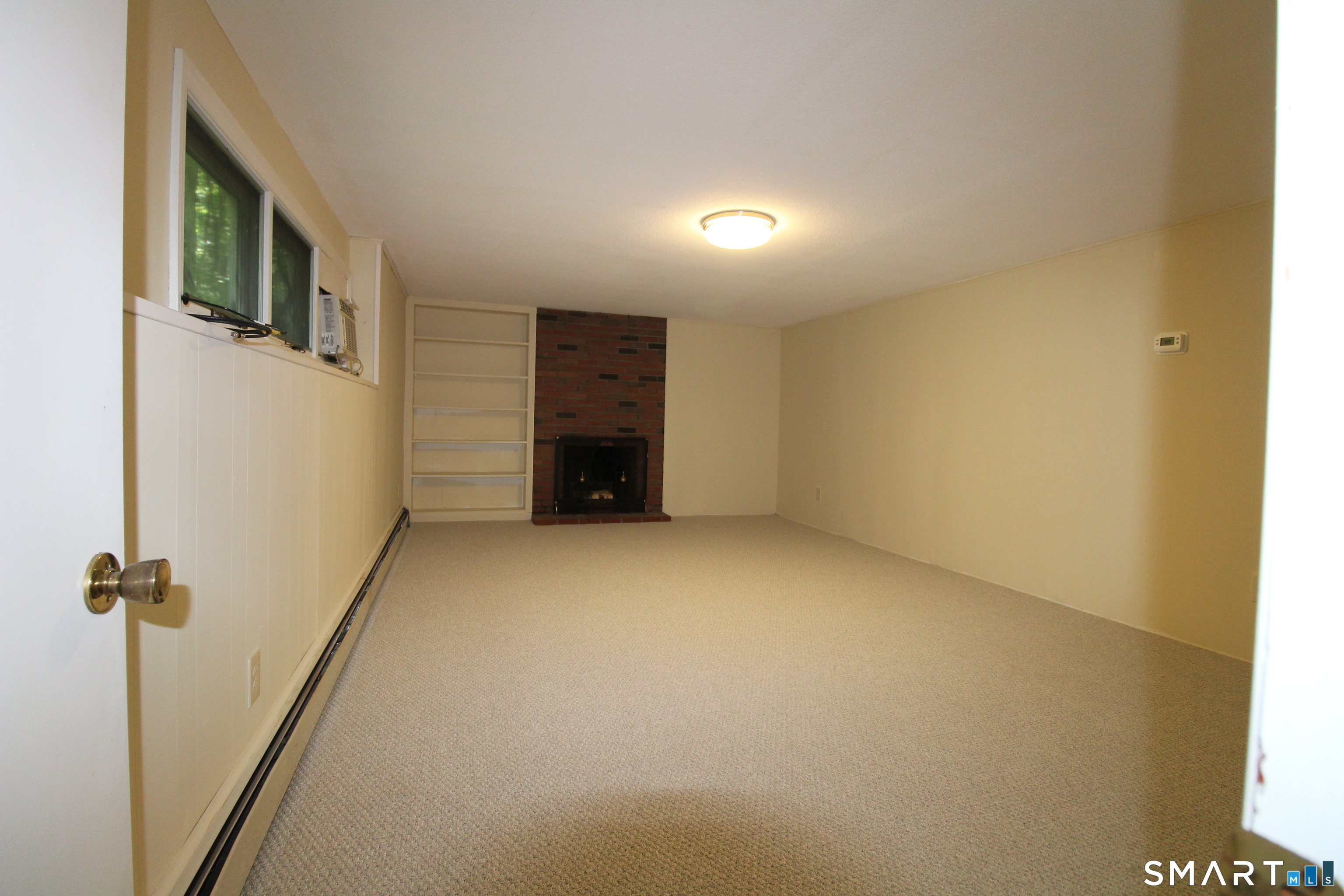 67 Mulberry Road Mansfield, CT 06250 - Photo 21 of 27 Downstairs family room with new paint and carpet