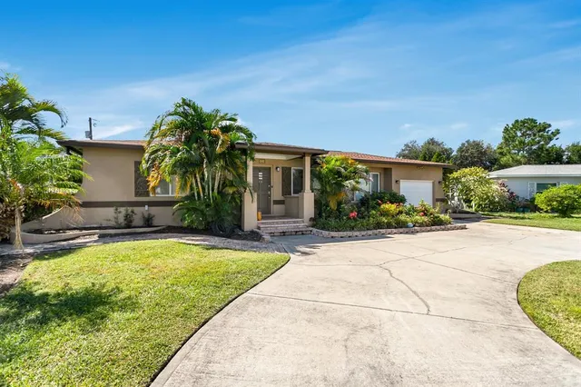 $574,999 | 4864 Lake Charles Drive North, Kenneth City, FL 33709