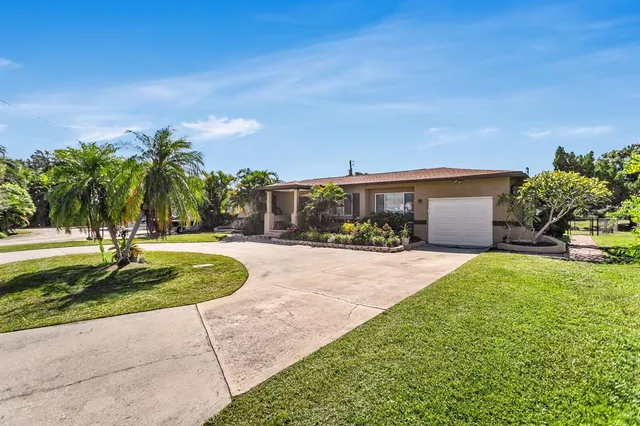 $574,999 | 4864 Lake Charles Drive North, Kenneth City, FL 33709