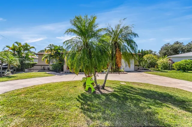 $574,999 | 4864 Lake Charles Drive North, Kenneth City, FL 33709