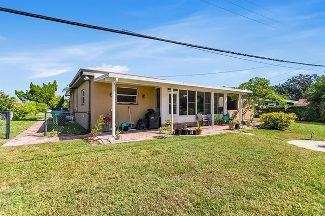 $574,999 | 4864 Lake Charles Drive North, Kenneth City, FL 33709