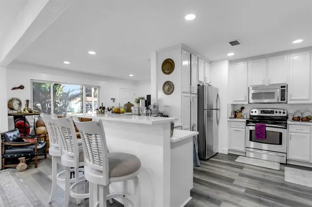 $574,999 | 4864 Lake Charles Drive North, Kenneth City, FL 33709