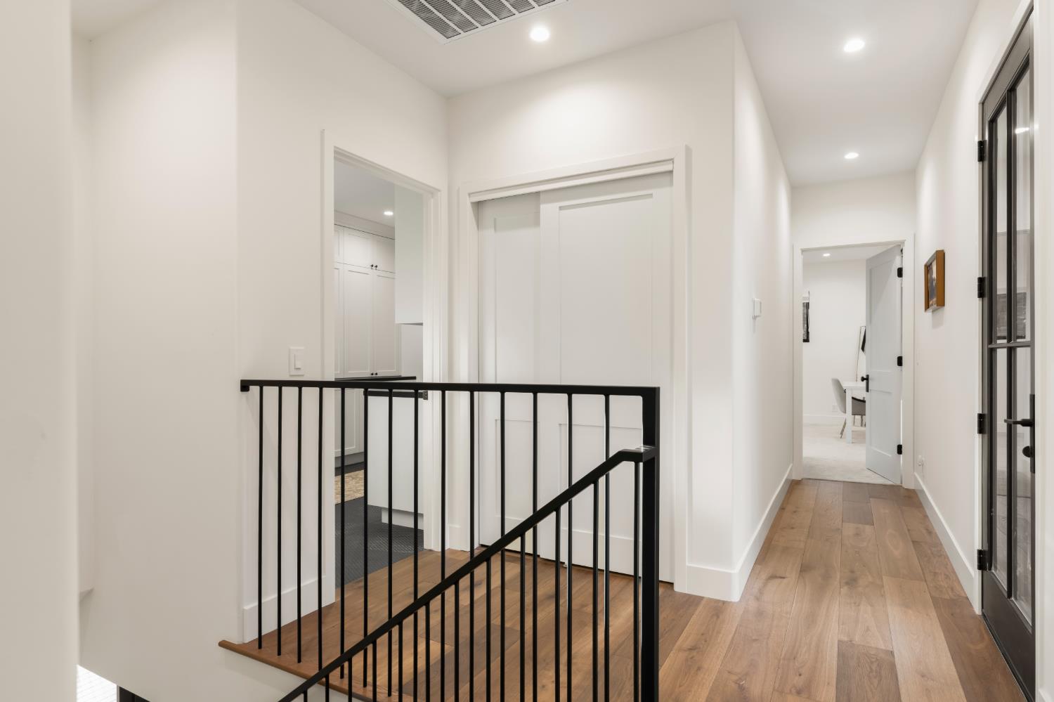 7697 Horseshoe Bar Road Loomis, CA 95650 - Photo 42 of 76 a view of a hallway with wooden floor and a bathroom