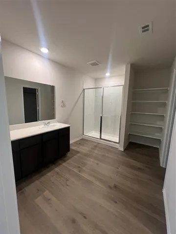 a bathroom with a double vanity sink and mirror