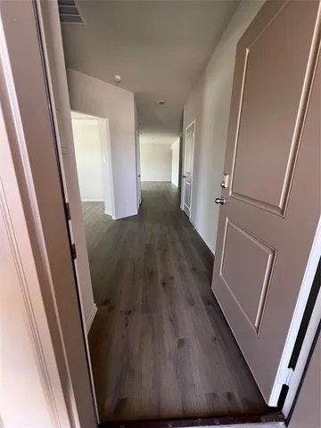 an entryway with wooden floor