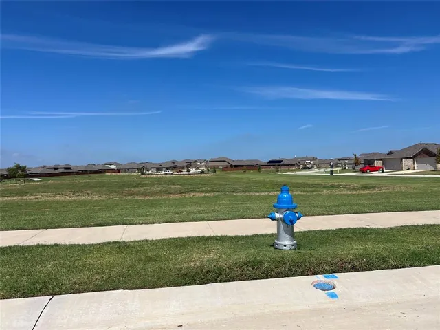 a view of a golf course with a lake view