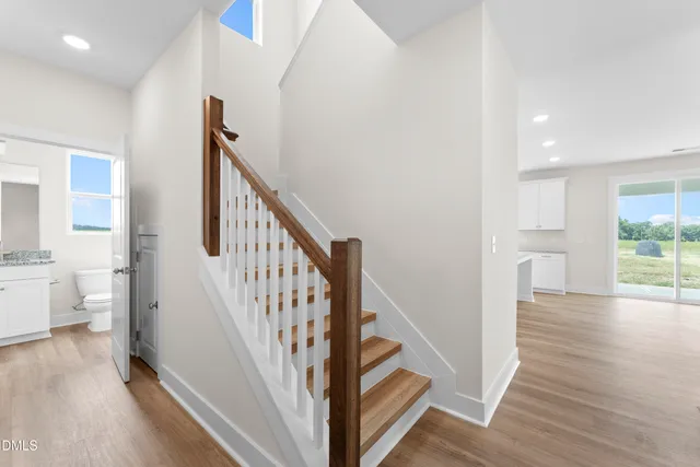 a view of entryway with wooden floor and stairs