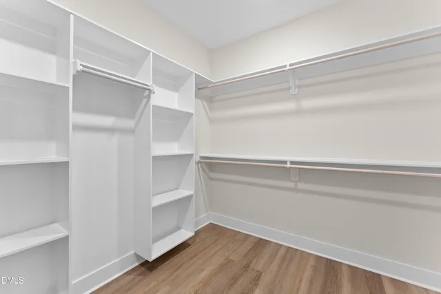 a view of an empty walk in closet