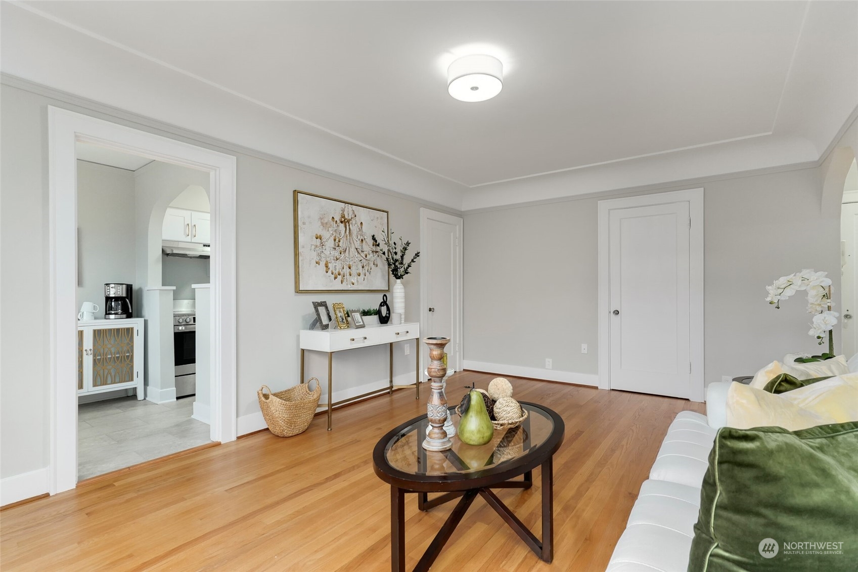 1605 East Olive Street, Unit 307 Seattle, WA 98122 - Photo 3 of 21 a living room with furniture and a wooden floor