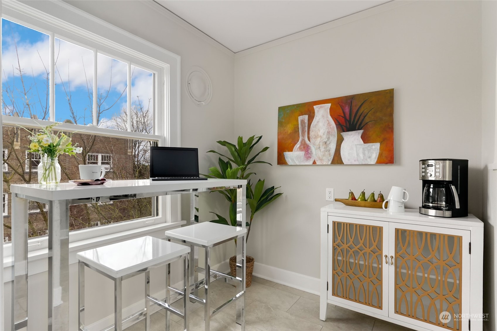 1605 East Olive Street, Unit 307 Seattle, WA 98122 - Photo 7 of 21 a kitchen with stainless steel appliances white cabinets and a stove top oven