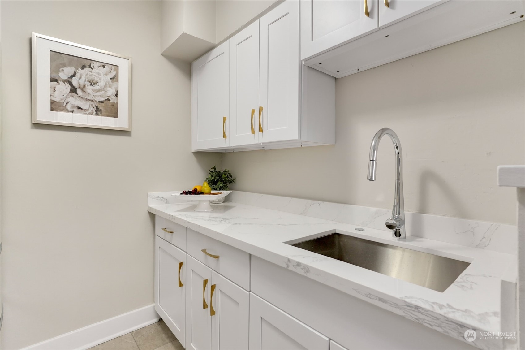 1605 East Olive Street, Unit 307 Seattle, WA 98122 - Photo 10 of 21 a kitchen with cabinets a sink and a stove with wooden floor