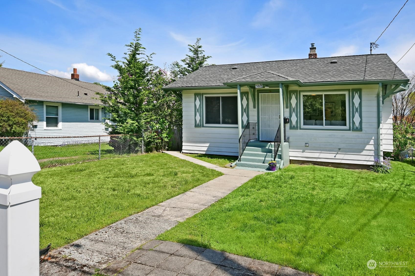 9448 18th Avenue Southwest Seattle, WA 98106 - Photo 1 of 20 a front view of a house with garden