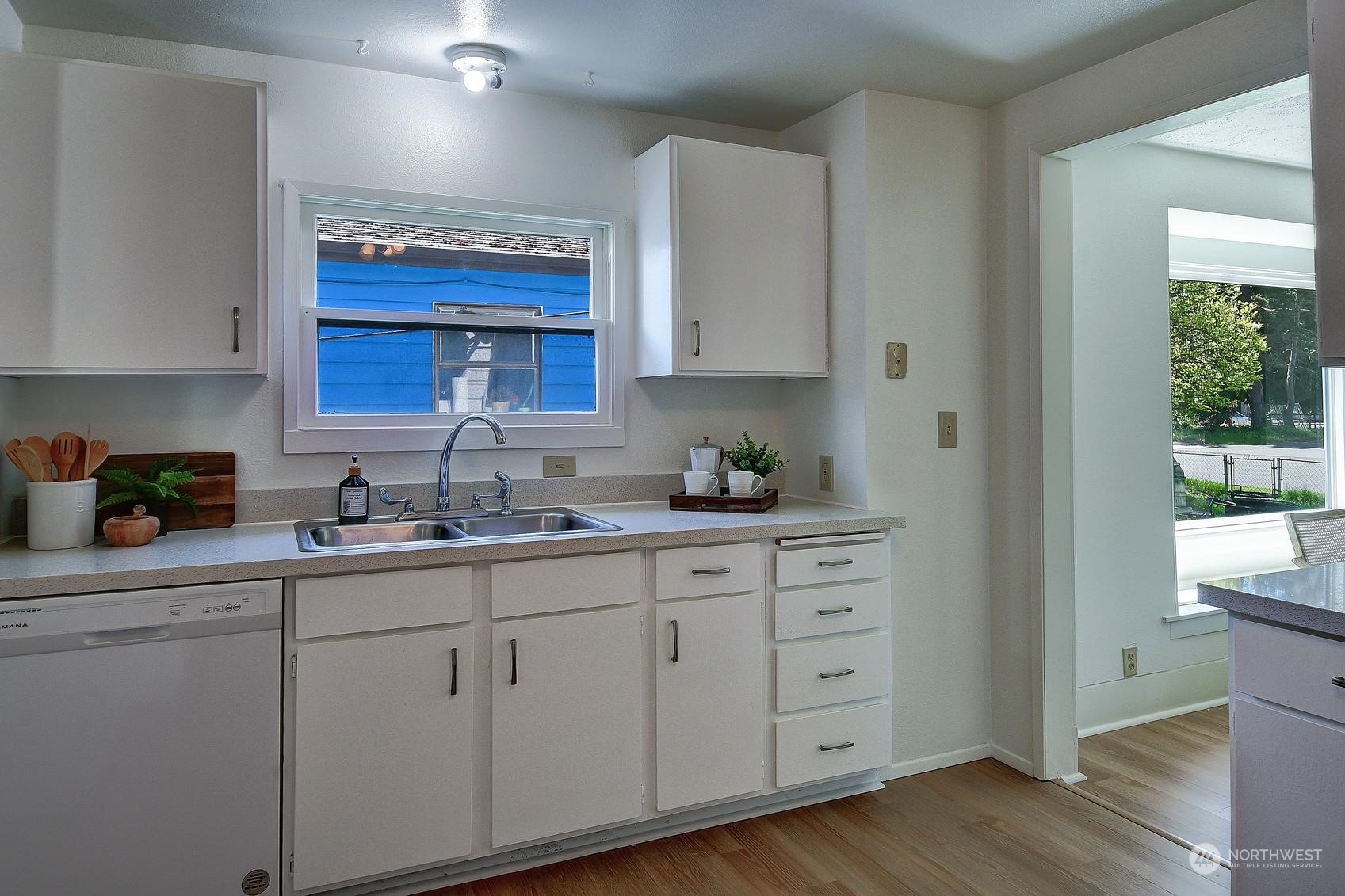9448 18th Avenue Southwest Seattle, WA 98106 - Photo 12 of 20 a kitchen with cabinets appliances a sink and a window
