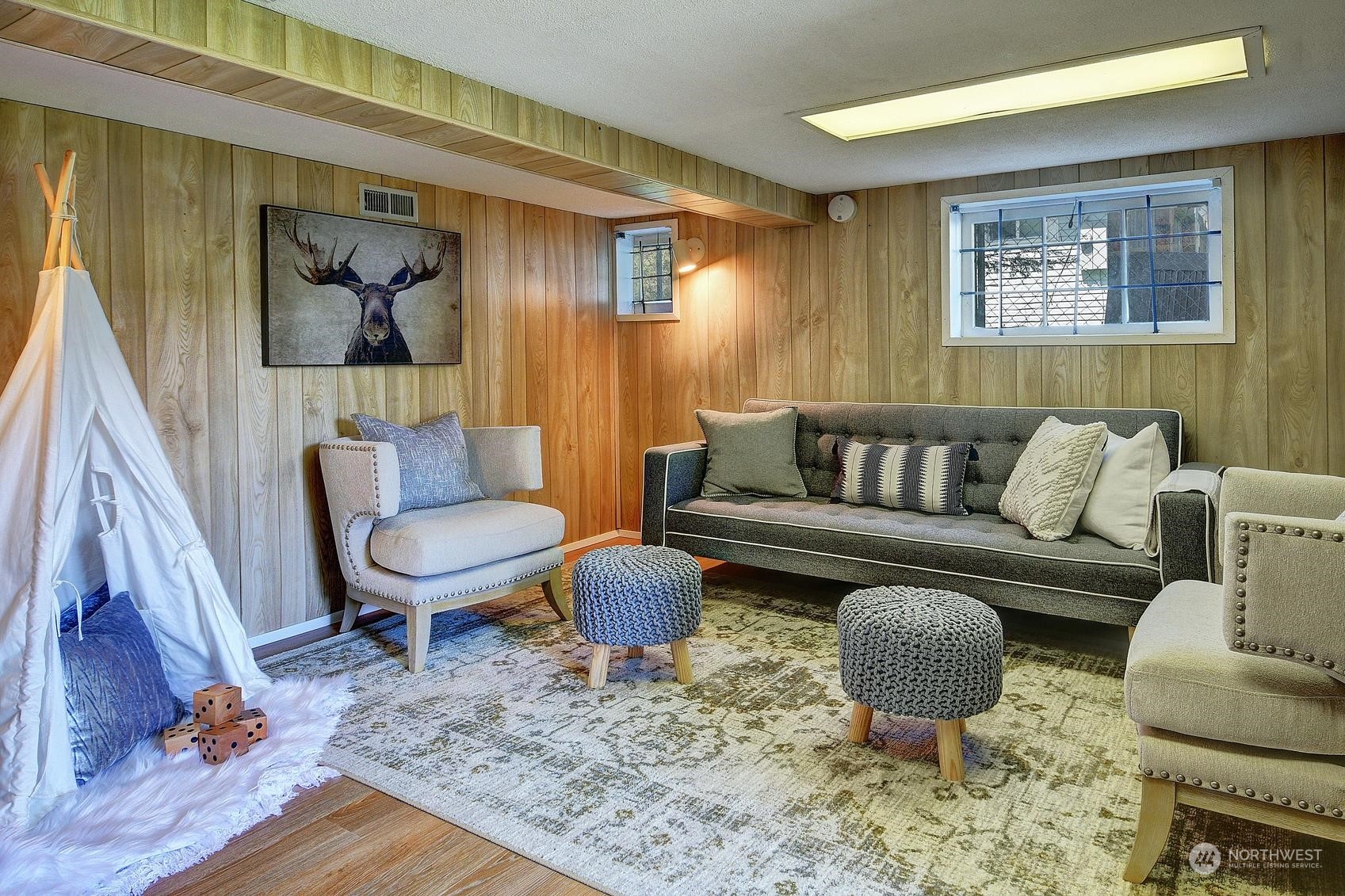 9448 18th Avenue Southwest Seattle, WA 98106 - Photo 13 of 20 a living room with furniture and a rug