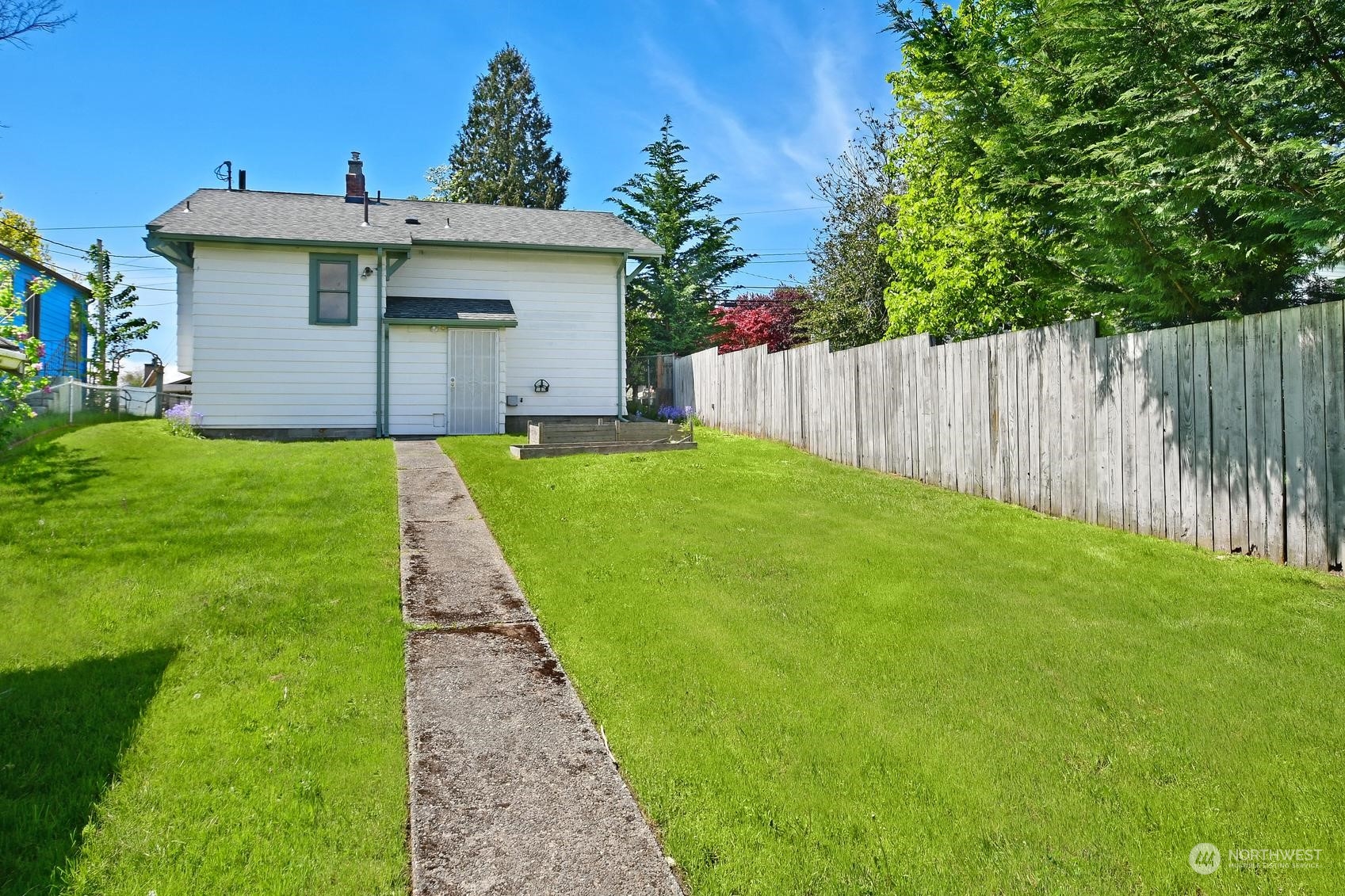 9448 18th Avenue Southwest Seattle, WA 98106 - Photo 18 of 20 a view of a house with a yard