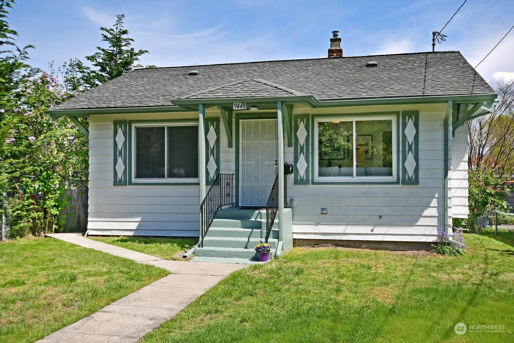 9448 18th Avenue Southwest Seattle, WA 98106 - Photo 2 of 20 a view of a house with backyard and garden