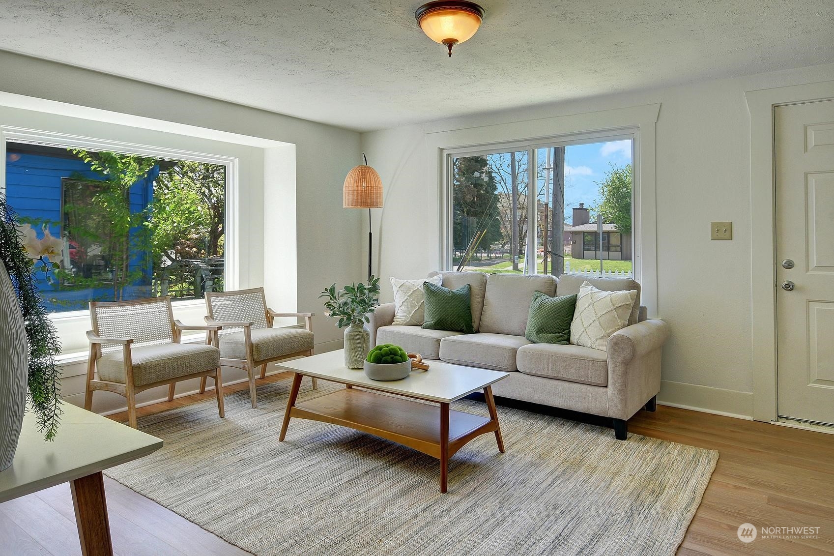 9448 18th Avenue Southwest Seattle, WA 98106 - Photo 4 of 20 a living room with furniture and a large window