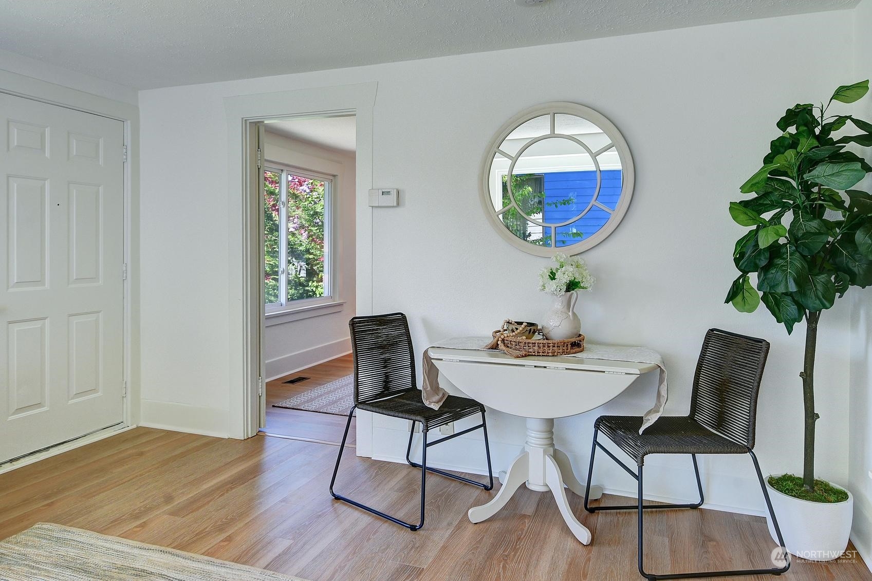 9448 18th Avenue Southwest Seattle, WA 98106 - Photo 6 of 20 a view of a dining room with furniture and wooden floor