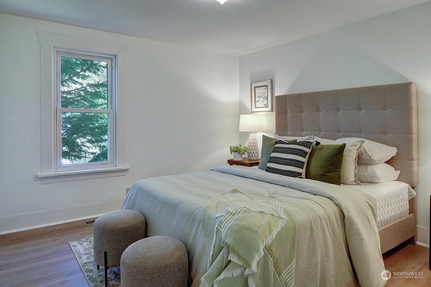 9448 18th Avenue Southwest Seattle, WA 98106 - Photo 7 of 20 a bedroom with bed and window